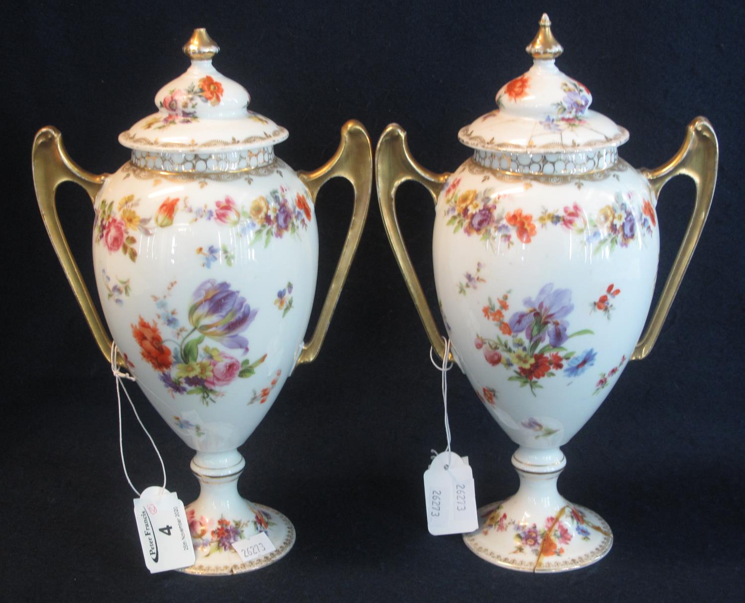 Pair of German porcelain floral transfer printed two handled urn shaped vases and covers, crowned