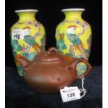 Chinese terracotta Yixing style melon shaped teapot, unmarked. Together with a pair of oriental