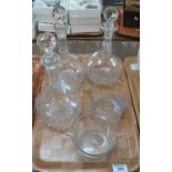 Pair of cut glass bottle decanters and stoppers, together with another similar decanter and