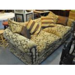 Large modern upholstered, deep two seater sofa with floral and foliate upholstery with scroll arms