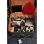 A ladies overnight bag containing a large assortment of costume jewellery and three modern gent's