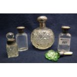 A group of five scent bottles to include; hobnail cut glass globular scent bottle with silver