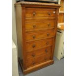 Victorian pale oak Wellington chest having moulded top with carved decoration above a straight front