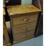 Late 19th/early 20th Century pine straight front narrow chest of three drawers on a platform