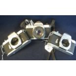 Three Pentax 35mm SLR camera bodies to include; K1000, Spotmatic and Spotmatic F, together with