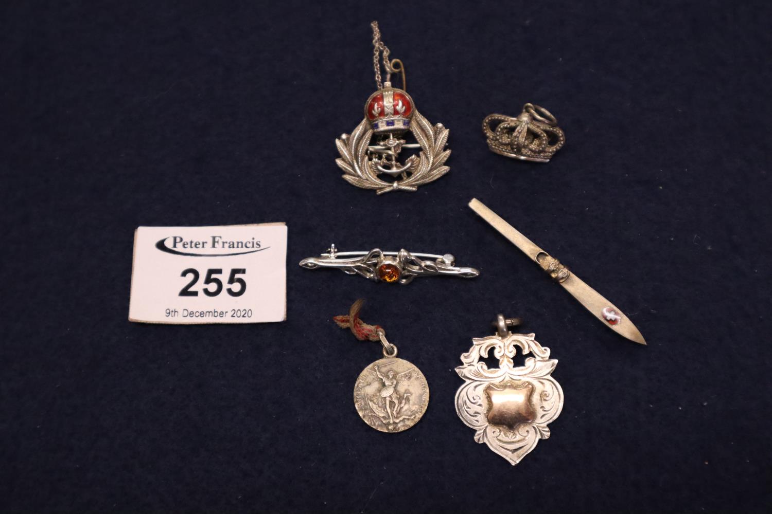 Collection of silver jewellery including a crown pendant and a brooch in the shape of a ski. (B.P.