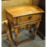Good quality oak side table with pull out drawer on barrel turned supports