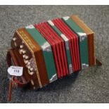 Mahogany concertina with ivorine buttons to each end and checkered inlaid decoration. (B.P. 21% +