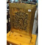Early 20th century brass fire screen with lion crest and moulded floral and foliate decoration. (B.