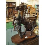 Modern carved hardwood study of a rearing horse on tree stump. (B.P. 21% + VAT)