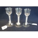 Three similar Georgian opaque multiple twist stem ale glasses with circular feet, two with