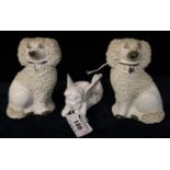 A pair of 19th Century Staffordshire pottery shredded clay poodles, together with a Japanese