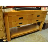 Good quality modern oak sideboard having four drawers above an under shelf on square supports. (B.P.