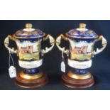 Two Aynsley bone china hand painted lidded two handled commemorative vases for Her Majesty Queen