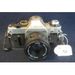 Canon AE-1 'Program' 35mm SLR camera with Canon 50mm lens. (B.P. 21% + VAT) Sold as seen, not