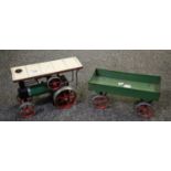 Mamod live steam model Traction Engine, together with four wheeled trailer in play worn