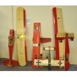 A group of scale model radio controlled model aircraft, all lacking their engines and in