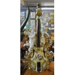 Capodimonte Italian table lamp in the form of a violin with cherubs and relief flowers. (B.P.