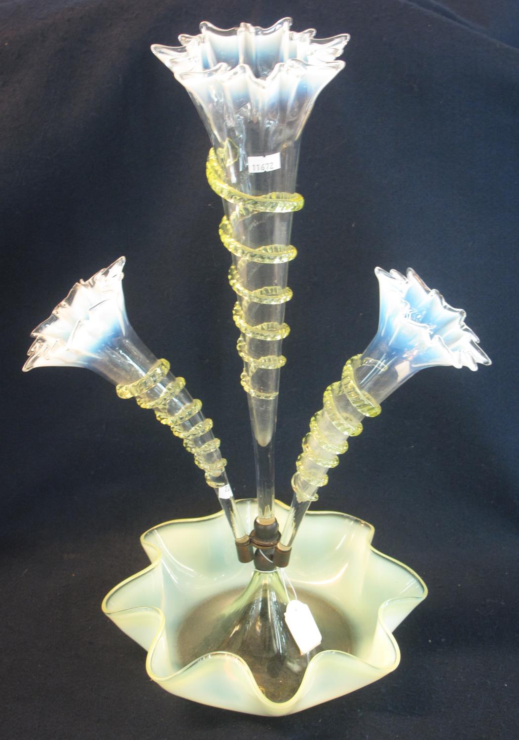 Victorian green vaseline glass epergne having single central tall flute with two shaped side flutes,