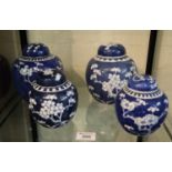 Two pairs of Chinese porcelain baluster shaped ginger jars and covers, all decorated with prunus