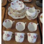 21 piece Aynsley bone china teaset on a fluted ground with flowers and foliage. (B.P. 21% + VAT)