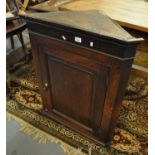 Late 18th/early 19th Century oak single door blind panelled hanging corner cupboard. (B.P. 21% +