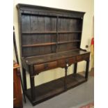 18th Century oak two stage rack back pot board dresser having moulded cornice above 'missing' shaped