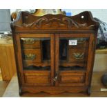 Edwardian oak two door glazed smokers cabinet. (B.P. 21% + VAT)