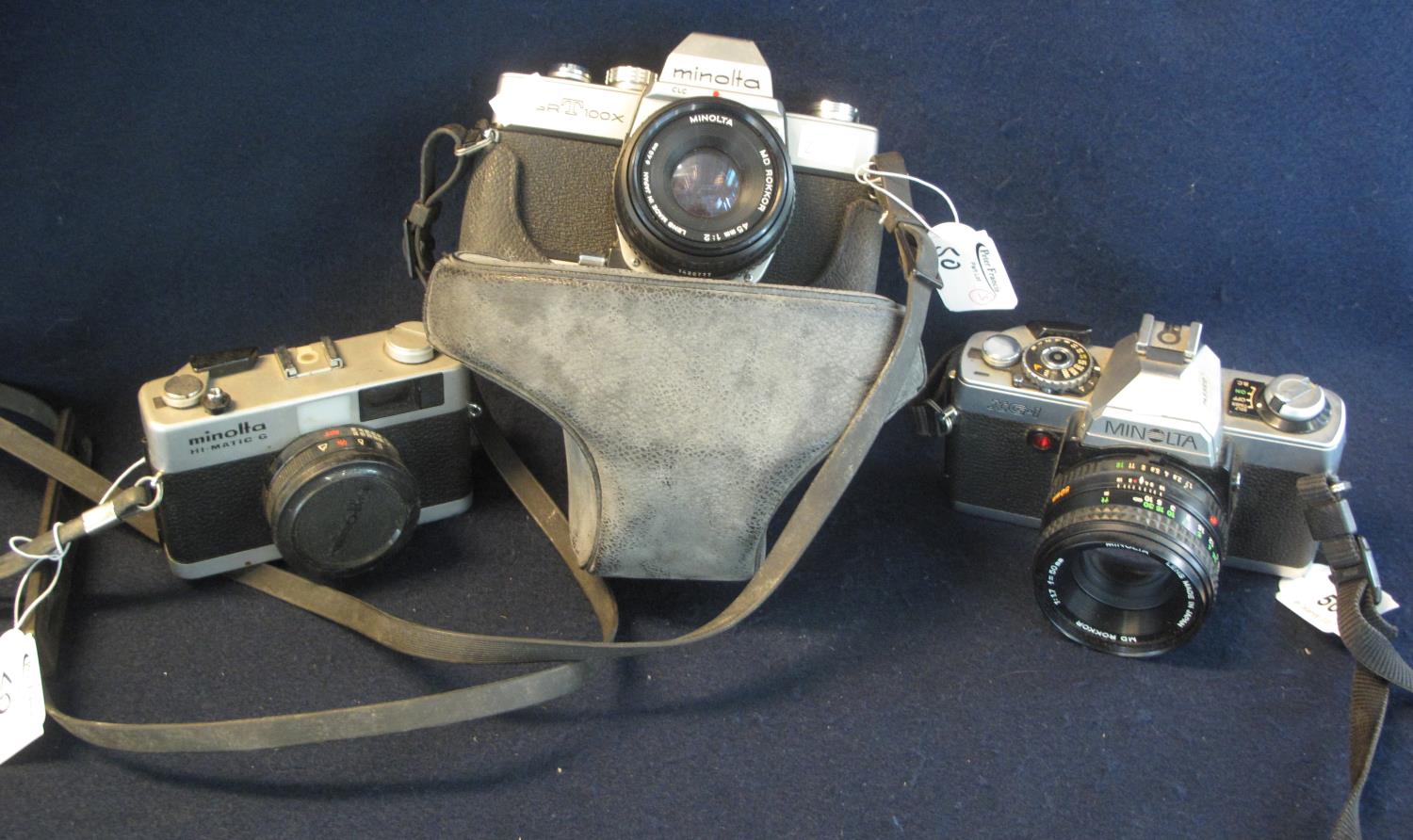 Three Minolta 35mm cameras to include; SRT 100X SLR with 45mm lens, XG-1 SLR with 50mm and a Minolta