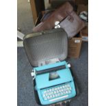 De Luxe Junior typewriter in fitted case, together with a vintage luggage case of small form,