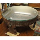 Unusual Indian carved wood coffee table with glass top (possibly Gujarati). (B.P. 21% + VAT)