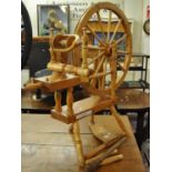 A traditional pine and beech spinning wheel by Frank Herring & Sons Dorchester. (B.P. 21% + VAT)