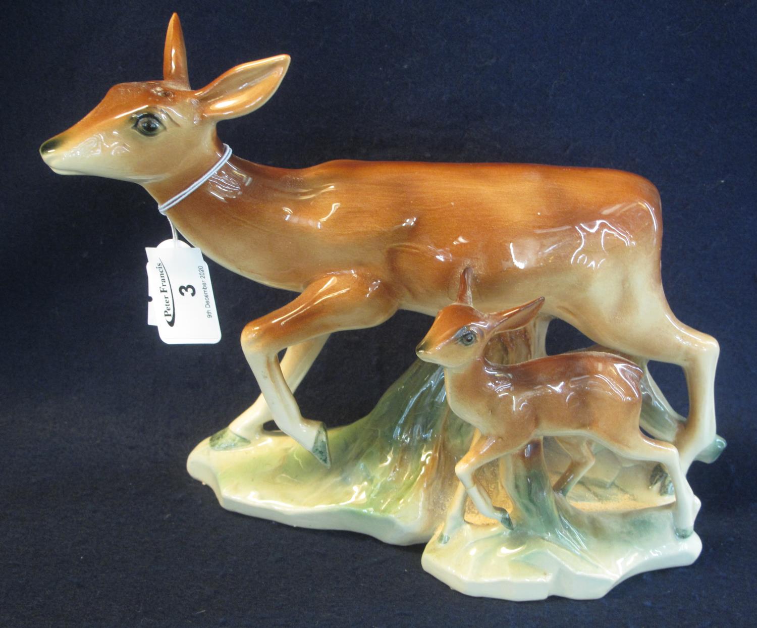 Dutch pottery group of a doe with fawn, on naturalistic base with plastic horns, impressed marks