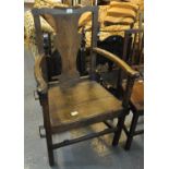 Early 19th century oak splat back open armchair with shaped arms above a moulded seat on