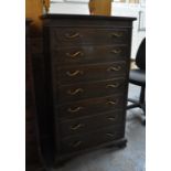 Early 20th century oak narrow straight front chest of seven drawers on projecting base and bracket