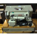 Alfa De Luxe sewing machine with fitted hood. (B.P. 21% + VAT)