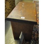 Solid oak stool with shaped sides of rectangular form. (B.P. 21% + VAT)