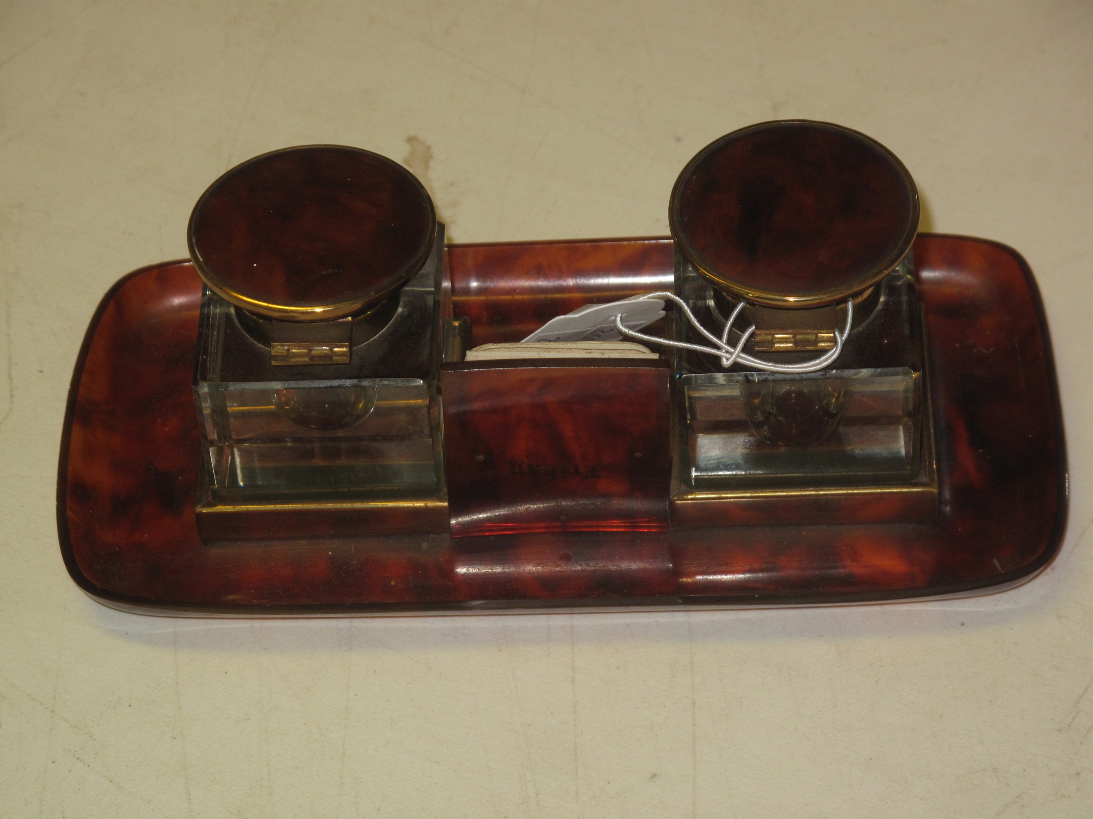 A simulated tortoiseshell brass mounted double inkwell desk stand with central calendar and - Image 3 of 4