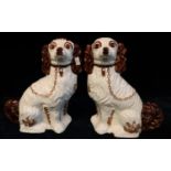 Pair of Staffordshire style pottery fireside spaniels with painted features. Modern. (B.P. 21% +