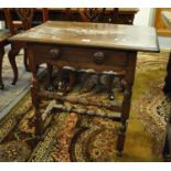 Small 17th Century oak side table or lowboy with moulded edge, overhanging top above frieze drawer