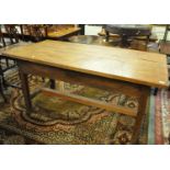 Good quality oak and mixed woods cleated three plank kitchen table with central stretcher. (B.P. 21%