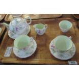 Aynsley English fine bone china tea for two set on a moulded ground with flowers and foliage. (B.