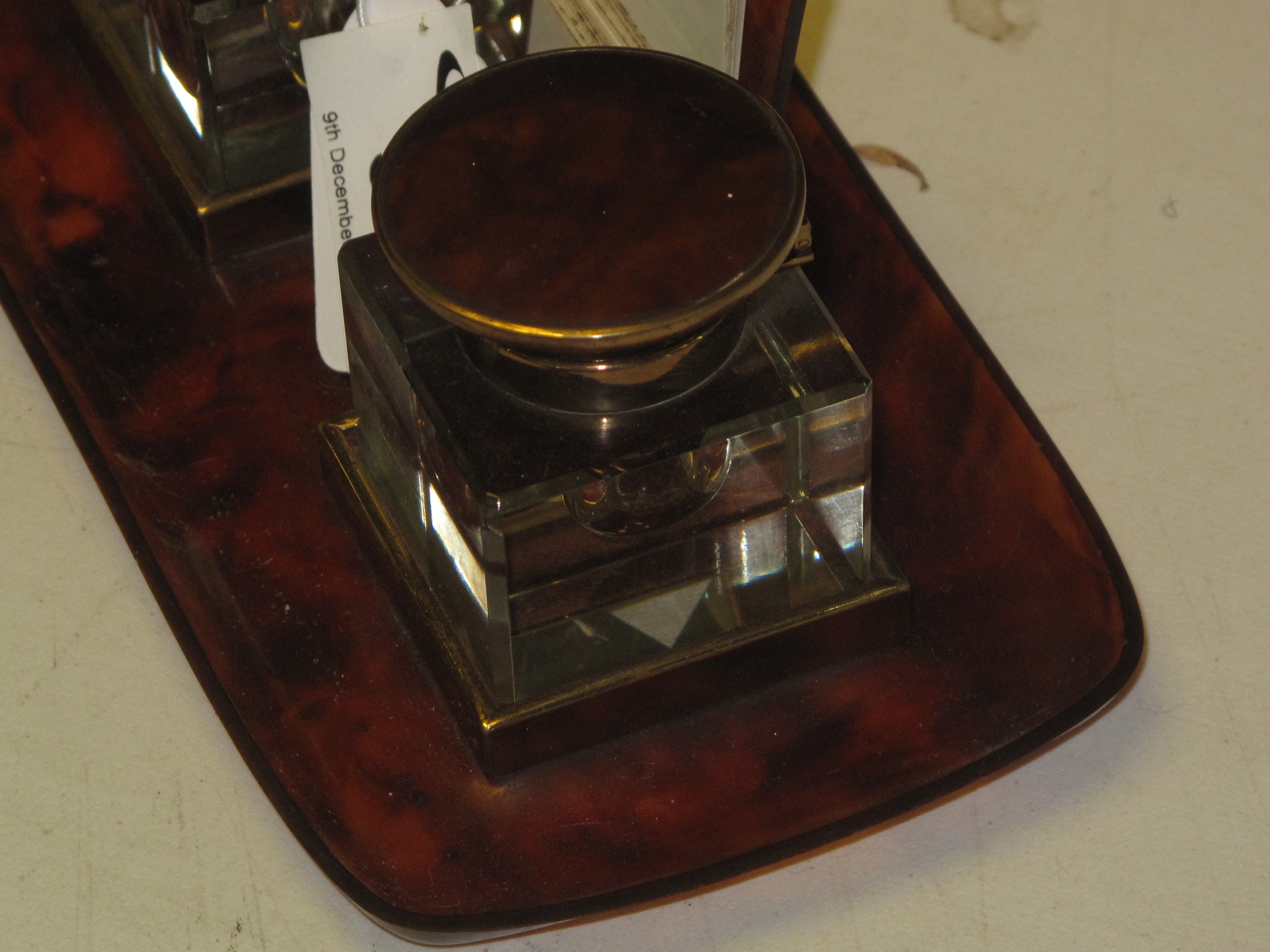 A simulated tortoiseshell brass mounted double inkwell desk stand with central calendar and - Image 4 of 4