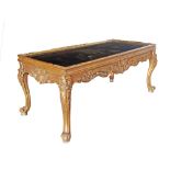 Carved and gilt wood center table.