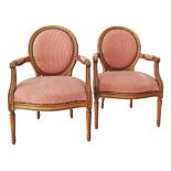 Louis XVI style walnut armchairs.