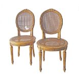 Louis XVI style giltwood salon chairs.