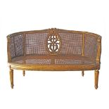 Louis XVI style carved and giltwood sofa en corbeille.