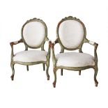 An Egyptian pair of Louis XV style carved cherry-wood green painted armchairs. W66cm, H97cm. With