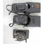 A collection of three old photo cameras comprising a Minolta AF-EII, a MINOLTA MULTI AF DATE 70W