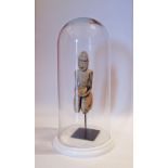 A wood sculpture in glass domes on marble plinth, H41cm, W20cm.